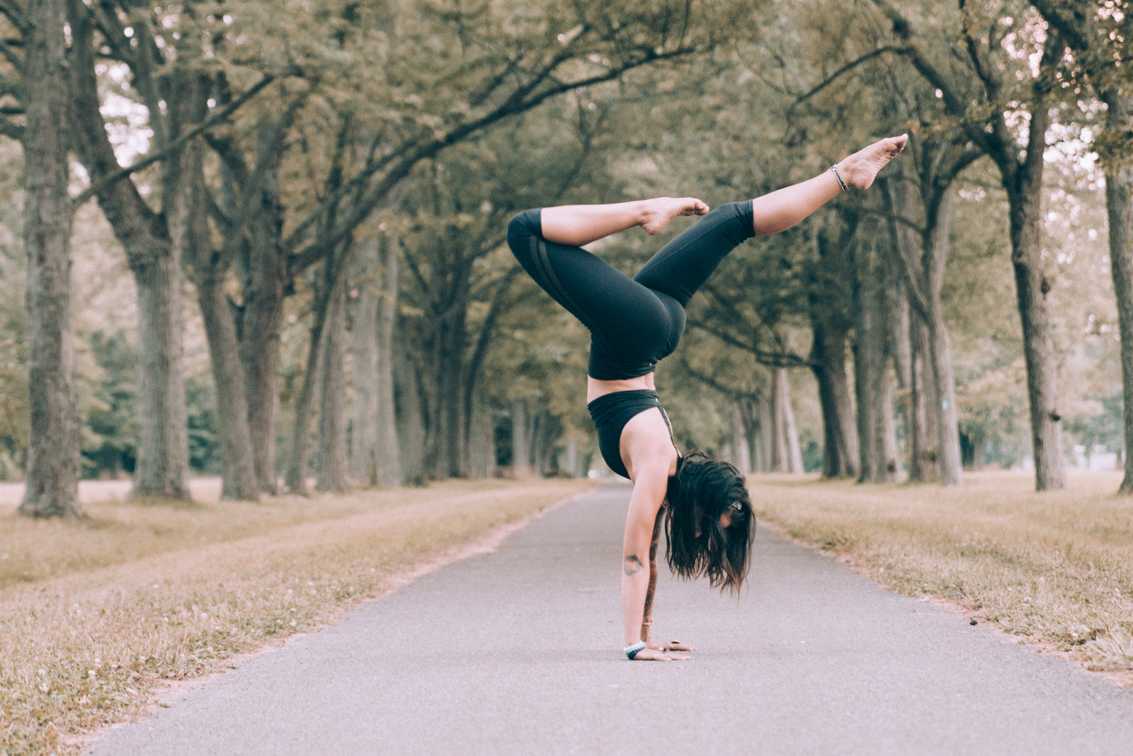 A woman balancing in a calm outdoor setting